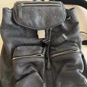 MCM Black Pebbled Leather Drawstring Backpack with Front Zip Pockets